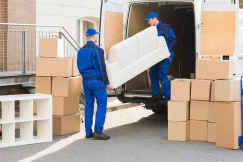 Packed moving boxes and furniture ready for house removals in Ilford