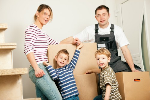 Trained movers securing items inside a van in Ilford