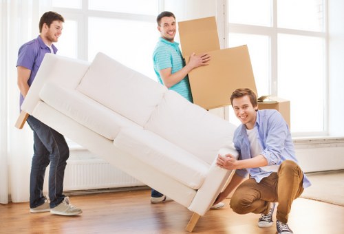 Loading office furniture for a business move near Ilford town centre