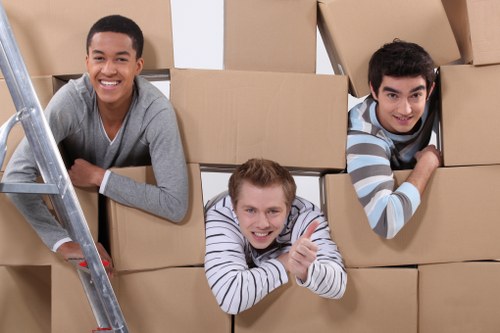 Furniture and boxes being loaded into a moving van in Ilford