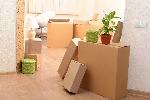Packed moving boxes and furniture ready for transport in Ilford