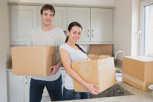 Unpacking boxes in a new Ilford home or flat